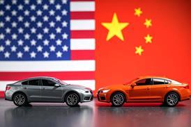 Cars in front of US and China flags - AI Generated