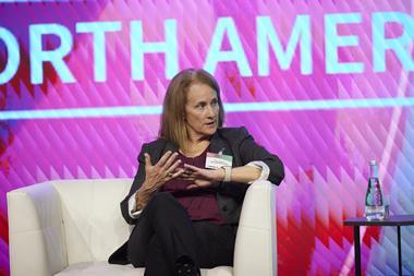 Rory Hepner speaking at Automotive Logistics' Finished Vehicle North America conference in 2023, she is mid-speech and sat on a white armchair