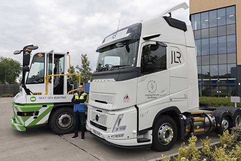 JLR's Levent Yuksel beside the carmaker's biomethane Electric trucks