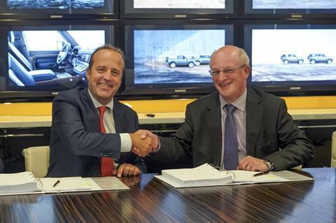 Oscar de Bok, CEO DHL Supply Chain and Ian Harnett, Executive Director, Human Resources & Global Purchasing at Jaguar Land Rover celebrate signing the new contract