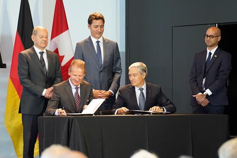 Canadian government representatives, including prime minister Justin Trudeau, sign an agreement for lithium supply with VW Group CEO Herbert Diess